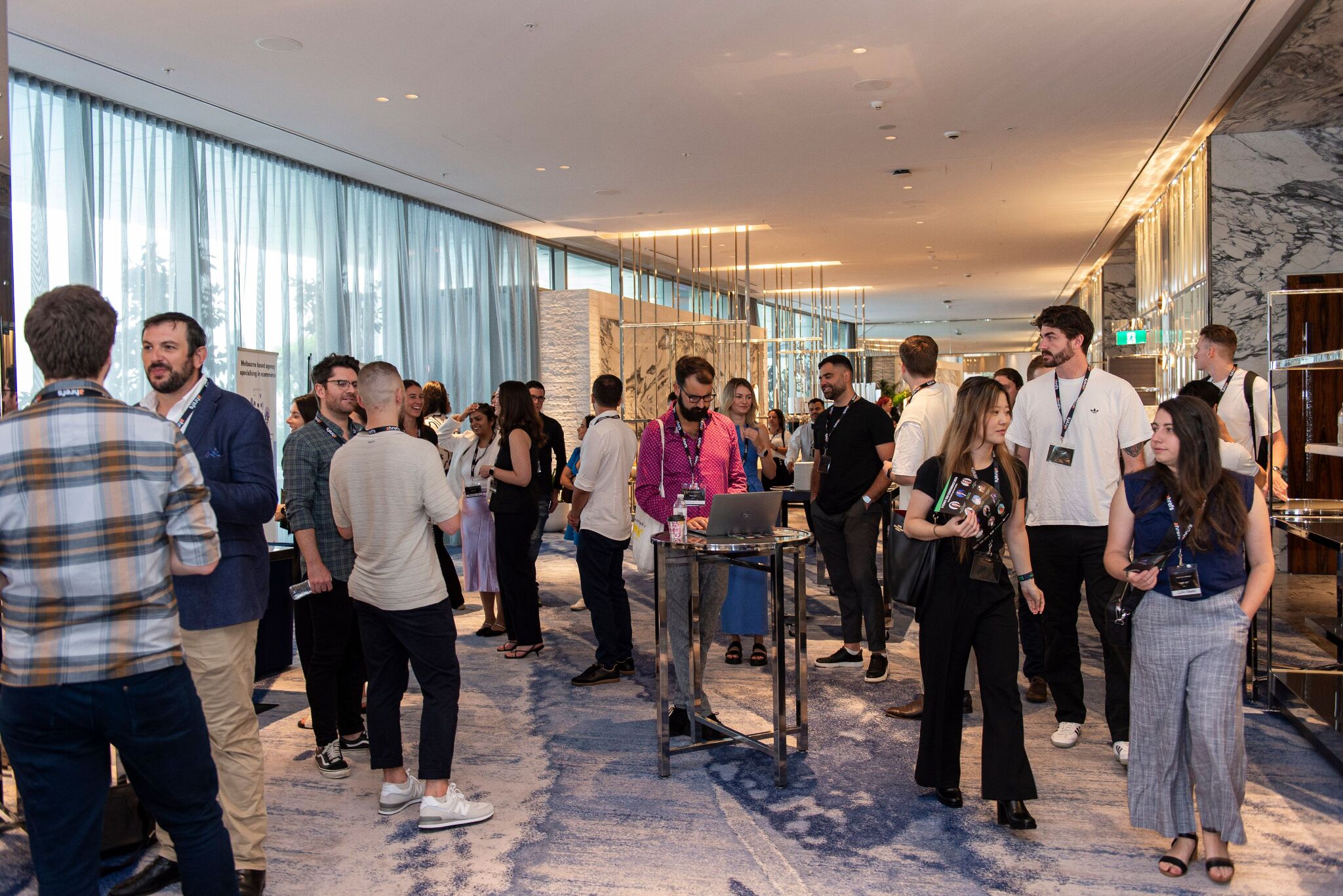 Photo of guests mingling during the breaks in the hotel's waiting area.